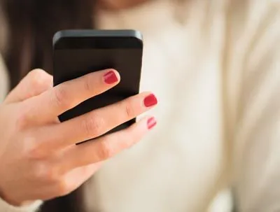 closeup of a woman holding her phone