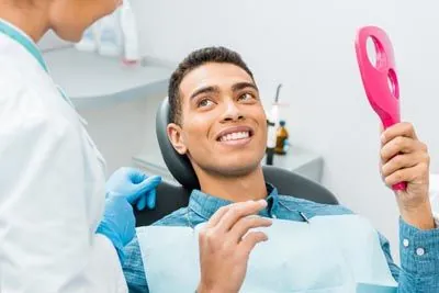 man talking with a hygienist during his dental appointment at Smile Studio Dentistry in Upland, CA