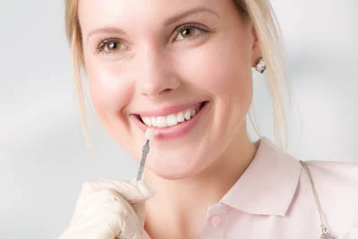 woman choosing what color dental veneers she wants