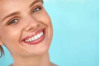 woman smiling with her freshly whitened teeth with services from Smile Studio Dentistry in Upland, CA