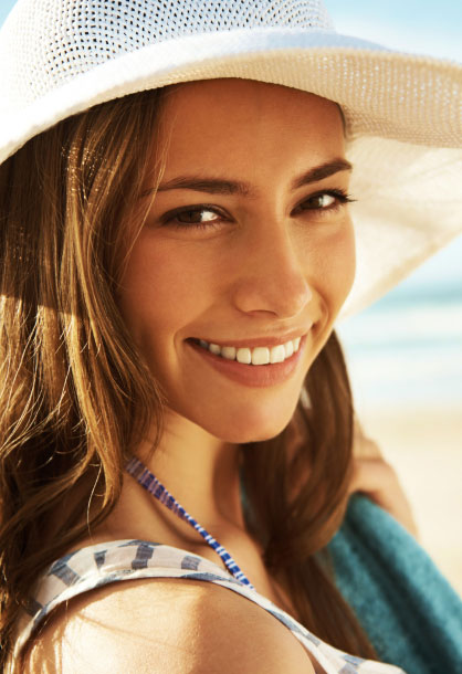 image of Young beautiful woman wearing hat